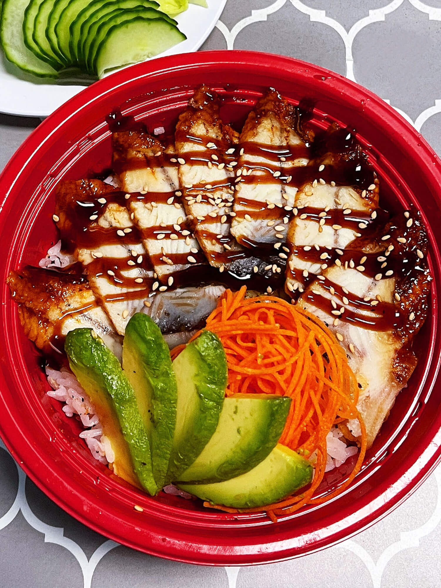 Aloha-Hawaiian-BBQ-&-Sushi-Asian-Fusion-restaurant-Grilled-Eel-Rice-Bowl-Baldwin-Park Grilled eel slices over rice, garnished with avocado Sushi burrito with chicken, avocado, and vegetables at Aloha Hawaiian BBQ & Sushi, a Asian Fusion restaurant in Baldwin Park